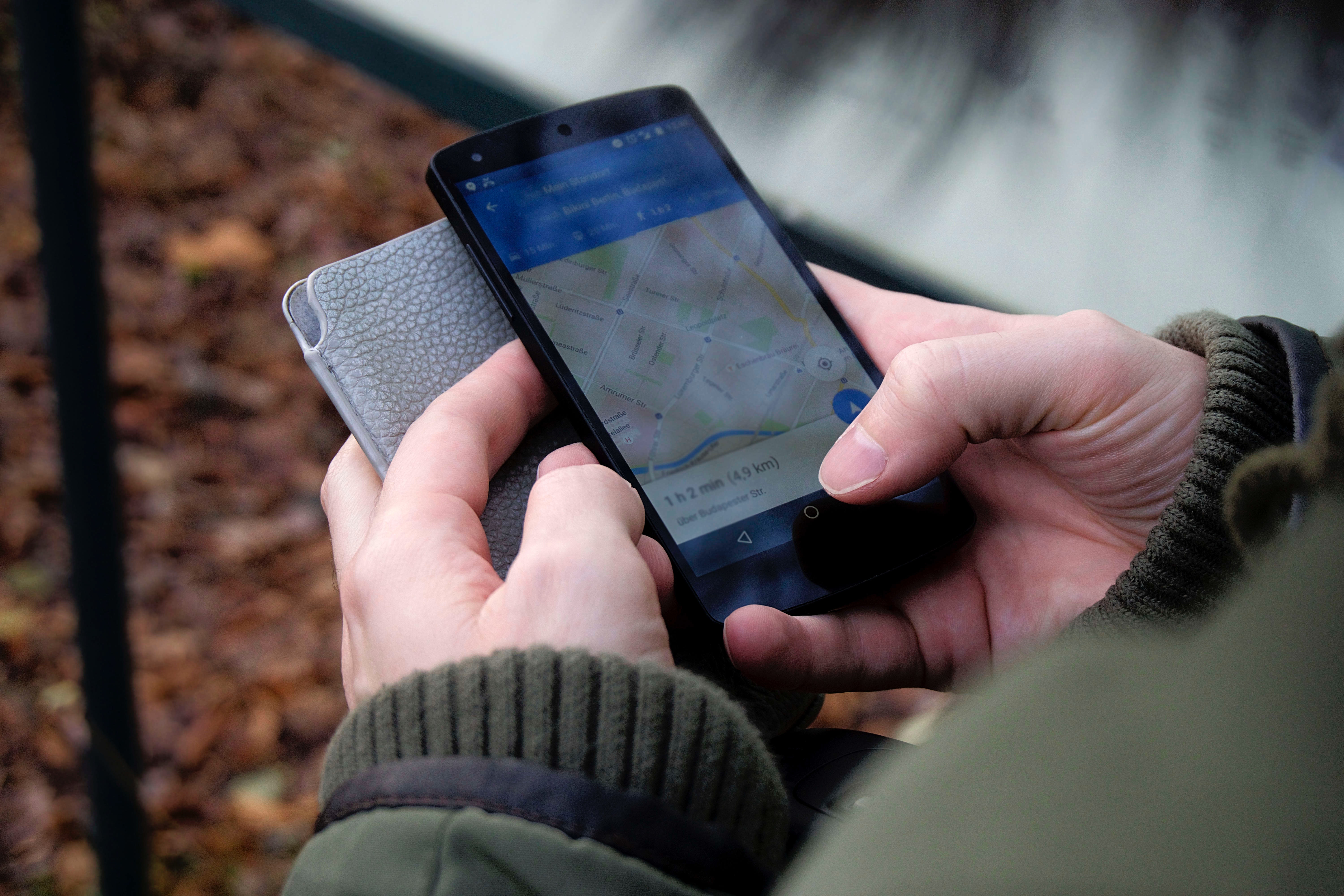 a person using geolocation with his smartphone