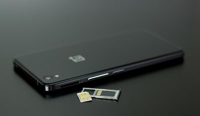 A smartphone is used to locate a Free sim card.