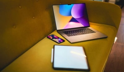 A computer, a tablet and an iPhone are used to recover photos from a lost or stolen phone.